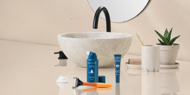 Selection of Harry's shaving products in front of a bathroom sink